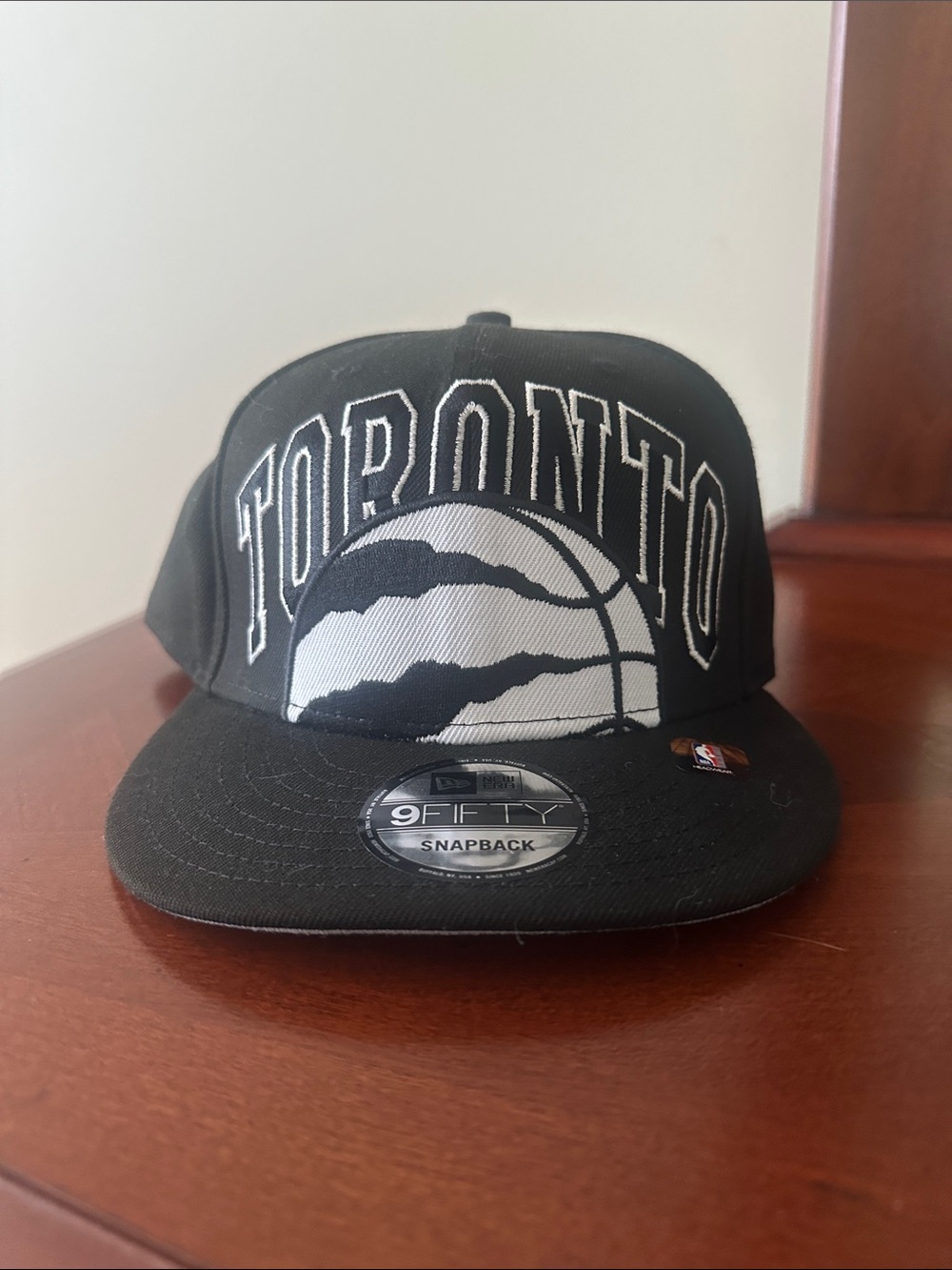 New Era Black and White Toronto  Raptors Snapback Hat